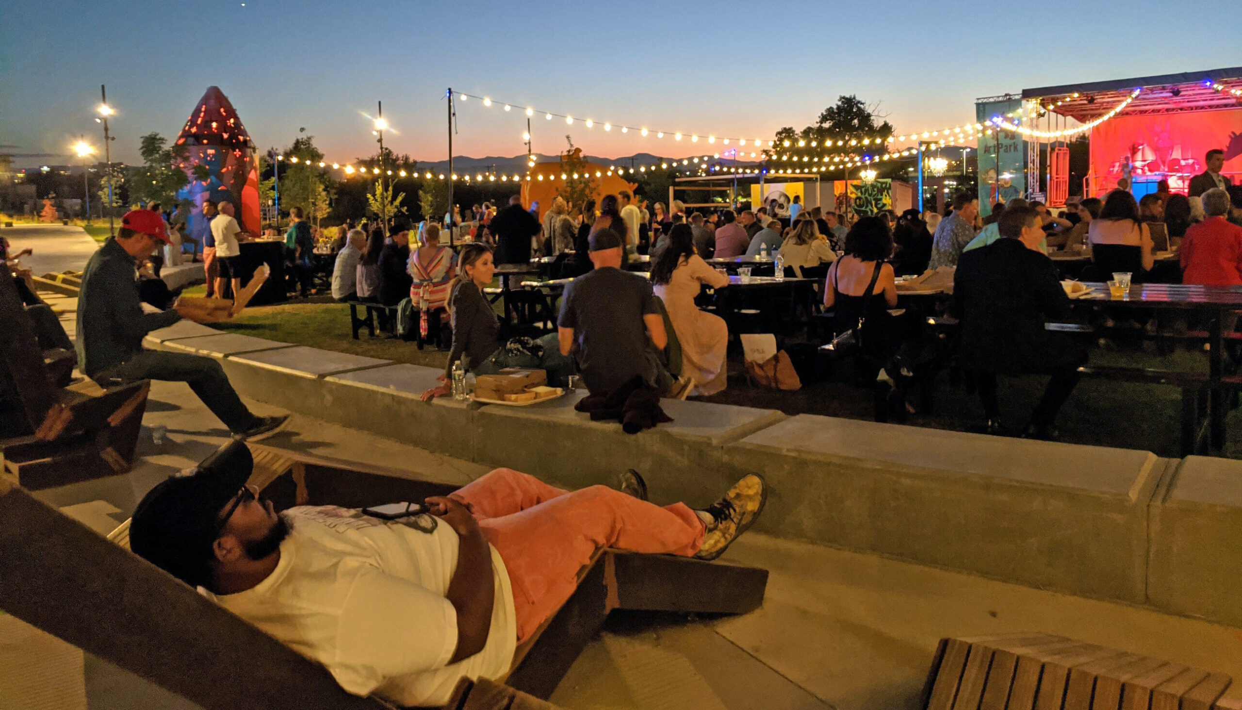 People watching a live band at Arkins Park